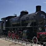 Retro Locomotive - black train under blue skies