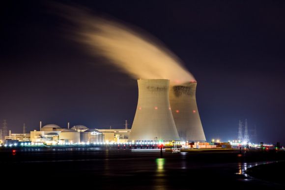 Nuclear Power - city skyline with lights turned on during night time