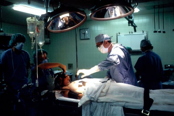 Heat Treatment - doctor and nurses inside operating room