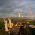 Thermal Power Plant - a large factory with a rainbow in the background